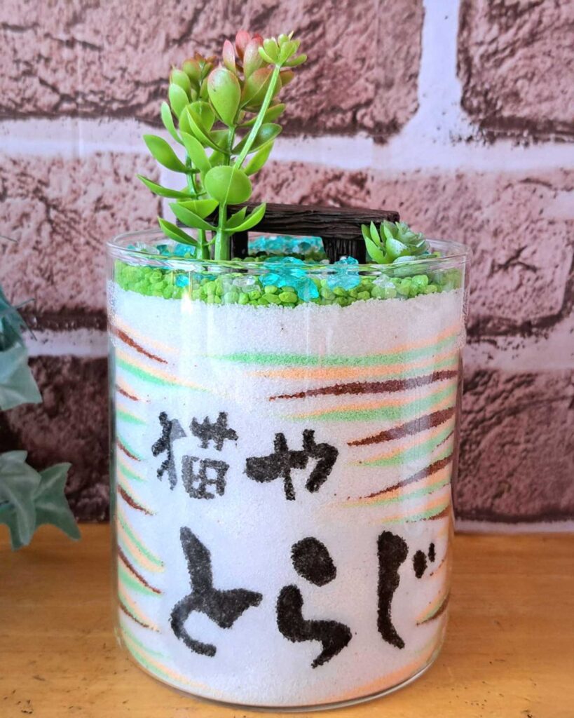 店名とロゴを入れたグラスサンドアート
後ろから見たところ